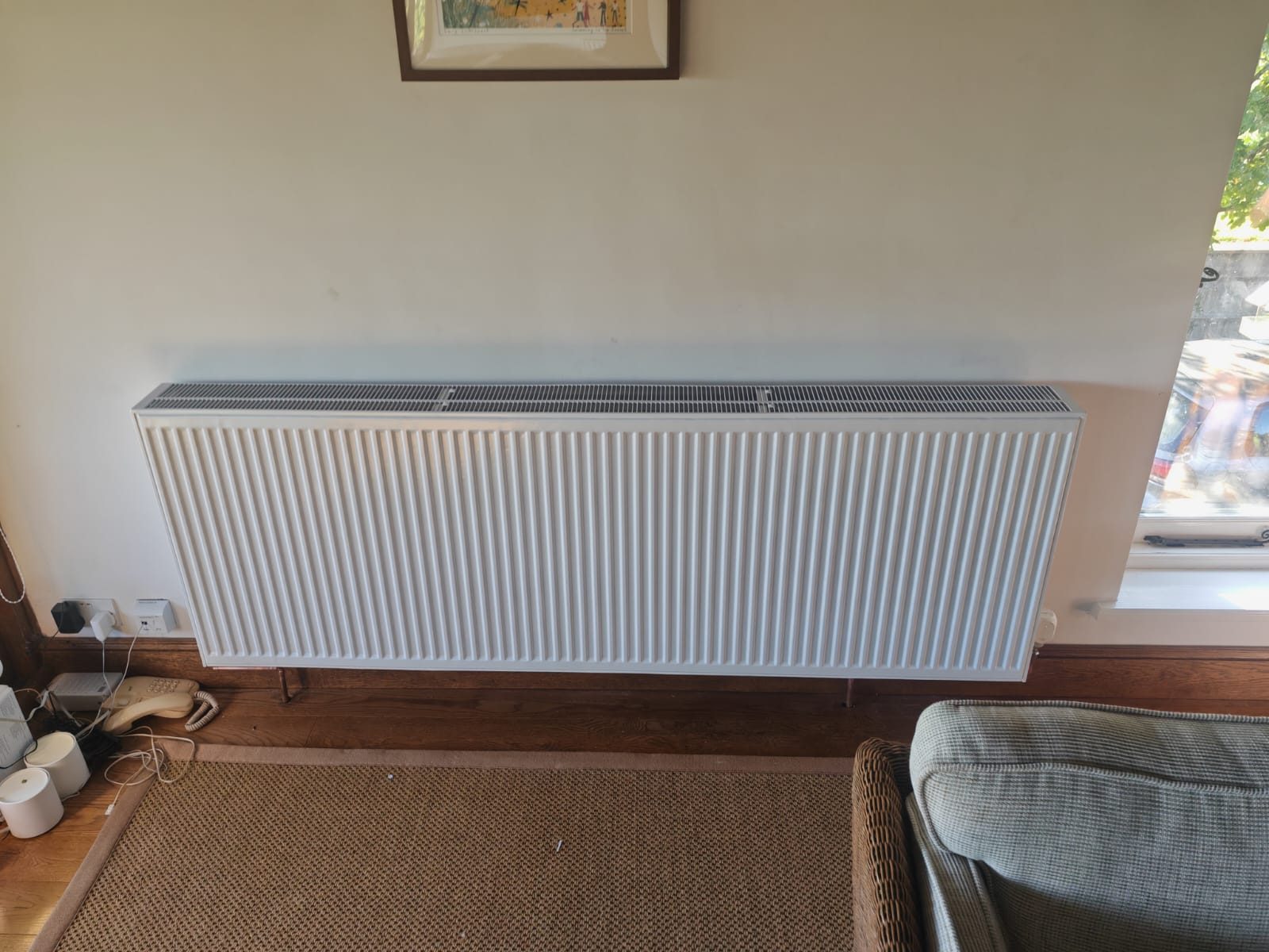 Radiator fitted along the sitting room wall. Whole house air source heat pump by FB Gas, photo 16