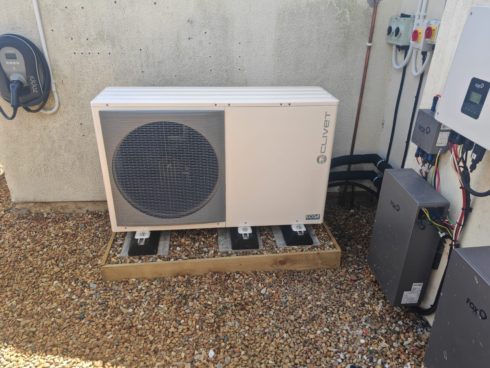 Clivet air source heat pump with battery storage on a pebble base