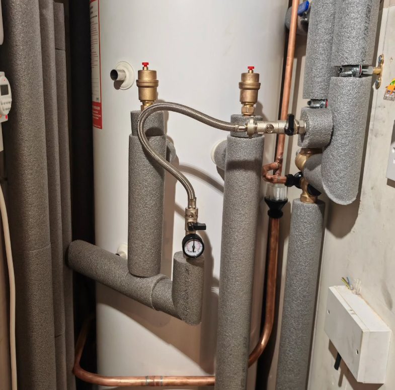 Cylinder with tidy copper pipework