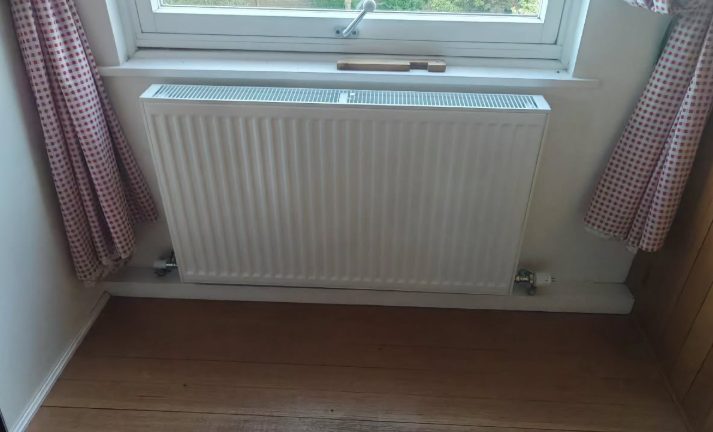 New radiator fitted under a window
