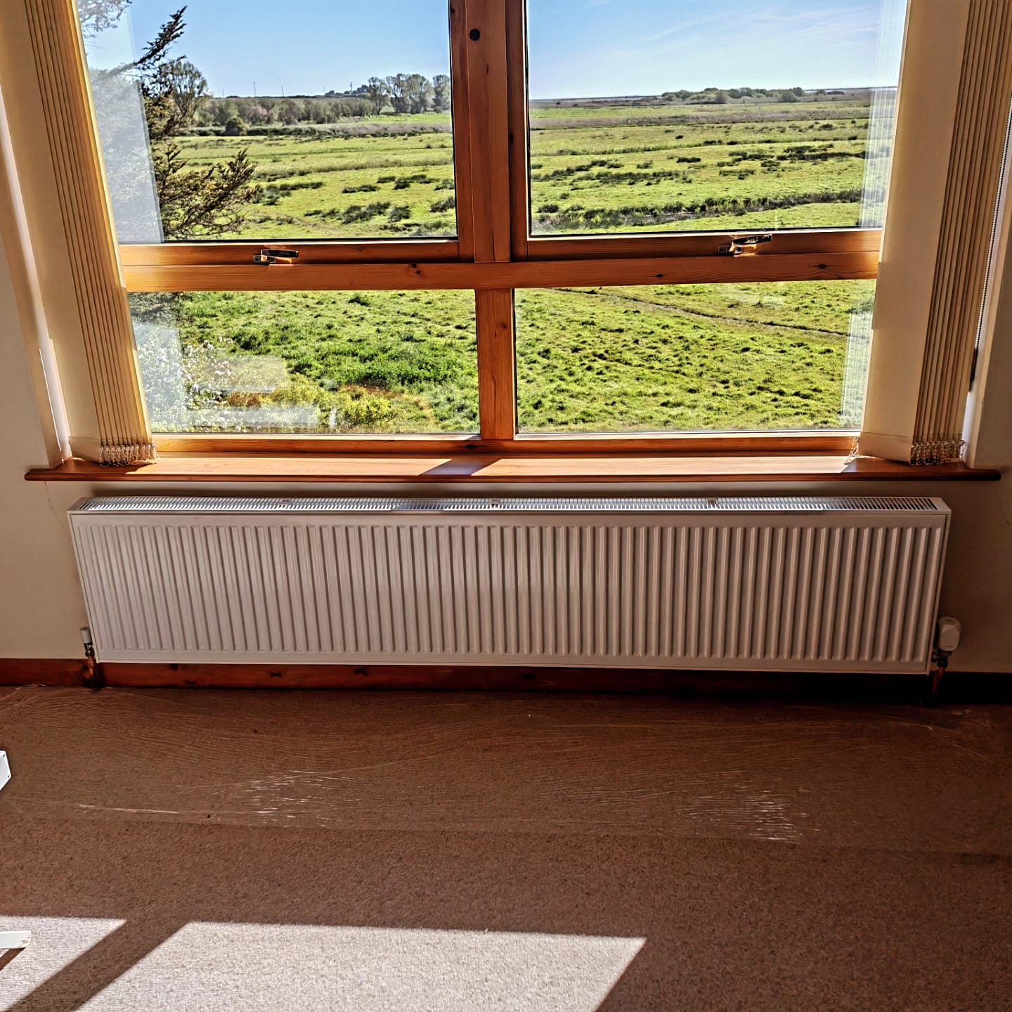 New radiator under a window with countryside views